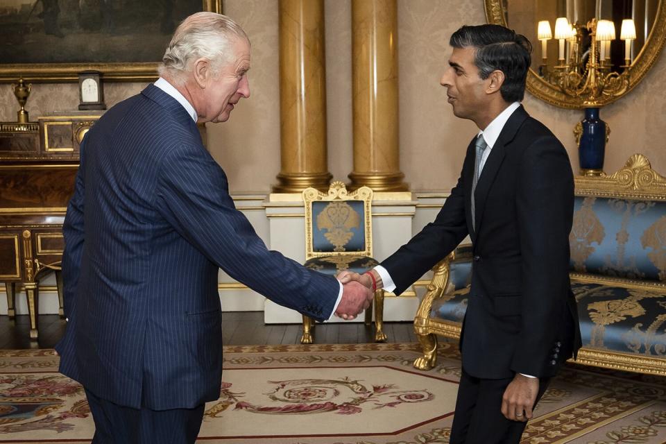 King Charles III welcomes Rishi Sunak during an audience at Buckingham Palace, London