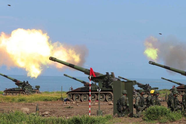 Taiwanese artillery guns fire live rounds during anti-landing drills as part of the Han Guang exercises held along the Pingtung coast in Taiwan (AP)
