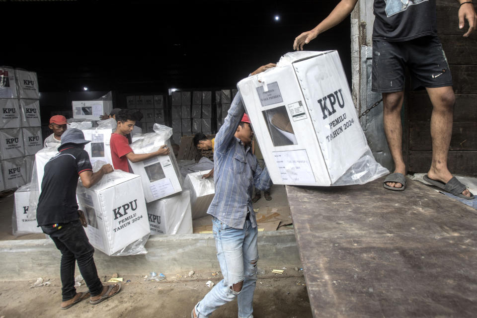 Workers load ballot boxes onto a truck to be distributed to polling stations ahead of the Feb. 14 election, in Medan, North Sumatra, Indonesia, Monday, Feb. 12, 2024. When millions of Indonesians pick their new president in one of the world's biggest elections, the United States and China would be closely watching who will next lead a key Asian battleground coveted for its huge market, nickel and voice. (AP Photo/Binsar Bakkara)