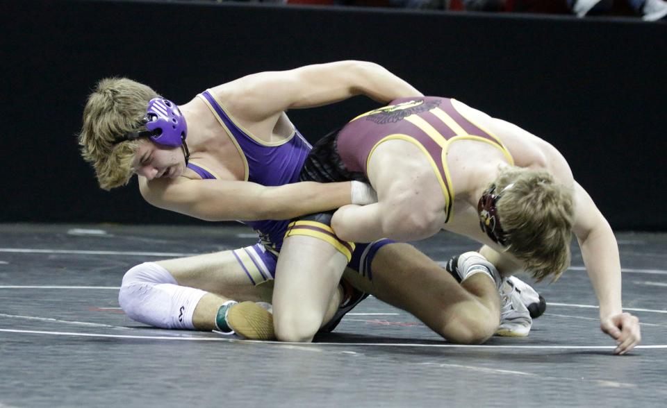 Two Rivers High School's Justin Klinkner, left, grips Luxemburg-Casco High School's Trace Schoenebeck in a 170-pound Division 2 match during the WIAA State Wrestling Team Tournament at the Kohl Center, Friday, February 25, 2022, in Madison, WI
