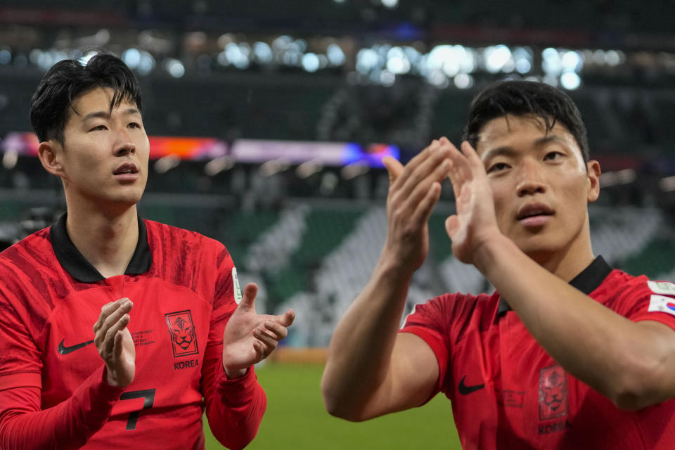 South Korea's Son Heung-Min, left, and South Korea's Hwang Hee-Chan celebrate after penalty shootout at the end of the Asian Cup Round of 16 soccer match between Saudi Arabia and South Korea, at the Education City Stadium in Al Rayyan, Qatar, Tuesday, Jan. 30, 2024. (AP Photo/Thanassis Stavrakis)