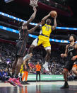Indiana Pacers forward Aaron Nesmith (23) is defended by Detroit Pistons center Jalen Duren during the first half of an NBA basketball game, Wednesday, March 20, 2024, in Detroit. (AP Photo/Carlos Osorio)