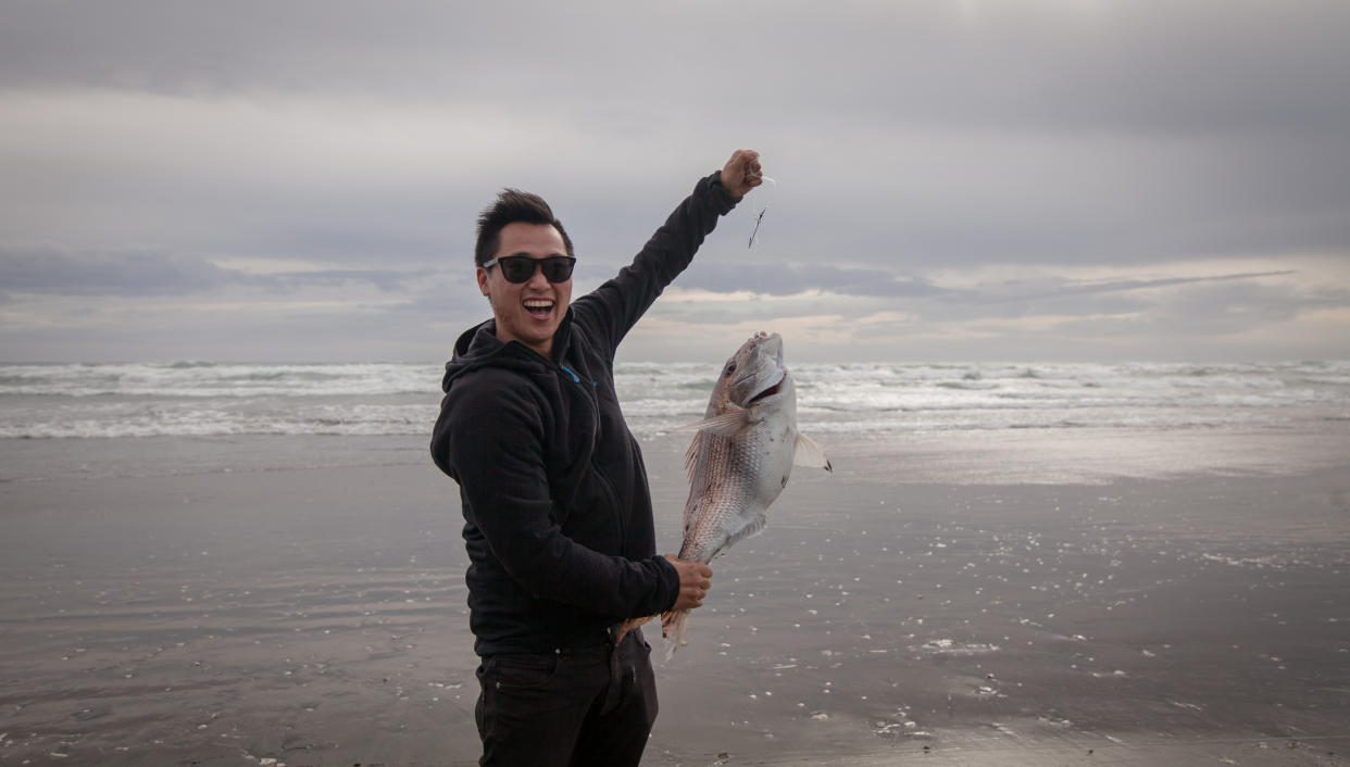A man posing with a fish he's caught is one of the biggest dating app turn-offs. (Getty Images)