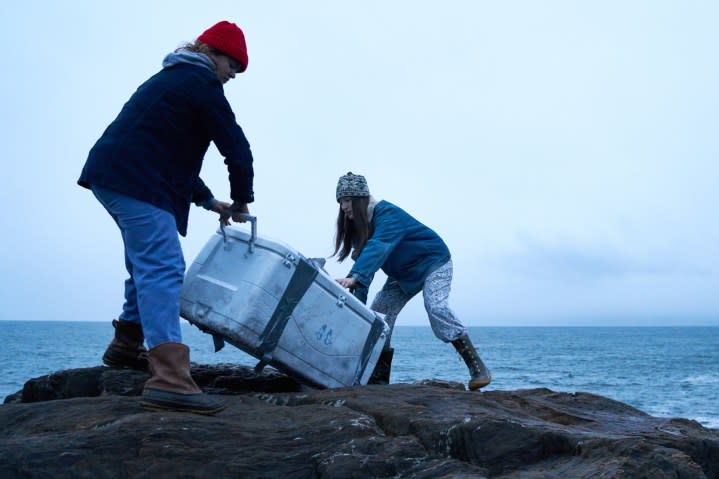 Two sisters carry an ice cooler in Blow the Man Down.