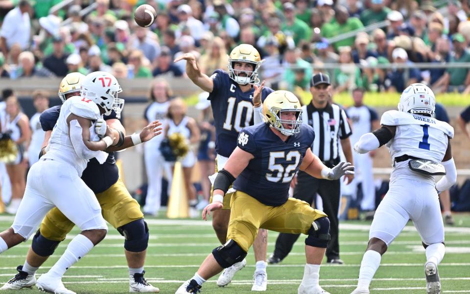 Sep 2, 2023; South Bend, Indiana, USA; Notre Dame Fighting Irish quarterback Sam Hartman (10) throws in the second quarter against the Tennessee State Tigers at Notre Dame Stadium. Mandatory Credit: Matt Cashore-USA TODAY Sports