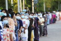 FILE - Voters line up to cast their ballots at a polling station in Naypyitaw, Myanmar on Nov. 8, 2020. Ousted Myanmar leader Aung San Suu Kyi is the daughter of the country’s independence hero, Gen. Aung San, who was assassinated in 1947, less than six months before the country, then called Burma, became independent from Britain. Suu Kyi moved to New Delhi in 1960 when her mother was appointed ambassador to India and then spent most of her young adult life in the United States and England. Her career in politics began in 1988. (AP Photo/Aung Shine Oo, File)