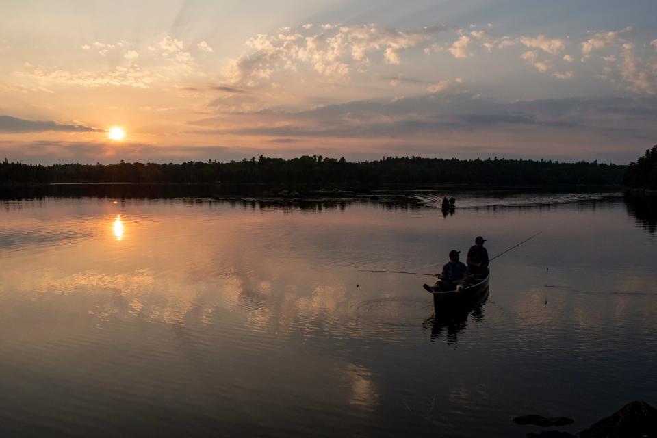 Two paddlers fish in a canoe on Boot Lake in the Boundary Waters Canoe Area Wilderness in September 2023. The wilderness area is a popular spot for canoe trips as well as other forms of recreation that bring in more than 150,000 visitors each year.