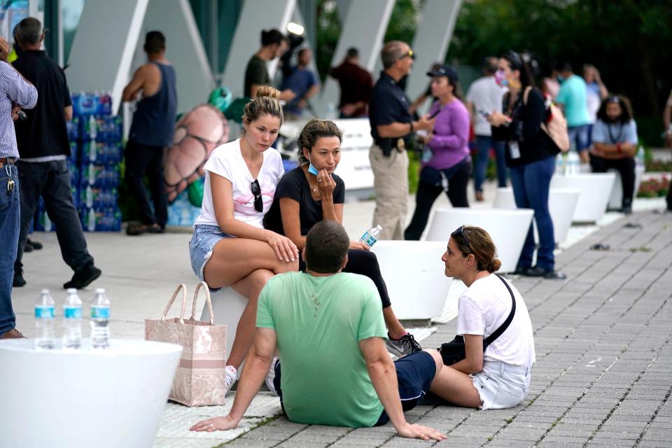 People wait for news at a family reunification center in Surfside after the partial collapse of the Champlain Towers South condo building. The community center was a gathering spot for the town before the tragedy.