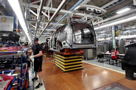 An FCA assembly worker works on the production line of the all-new 2017 Chrysler Pacifica minivan at the FCA Windsor Assembly plant in Windsor, Ontario, May 6, 2016. REUTERS/Rebecca Cook