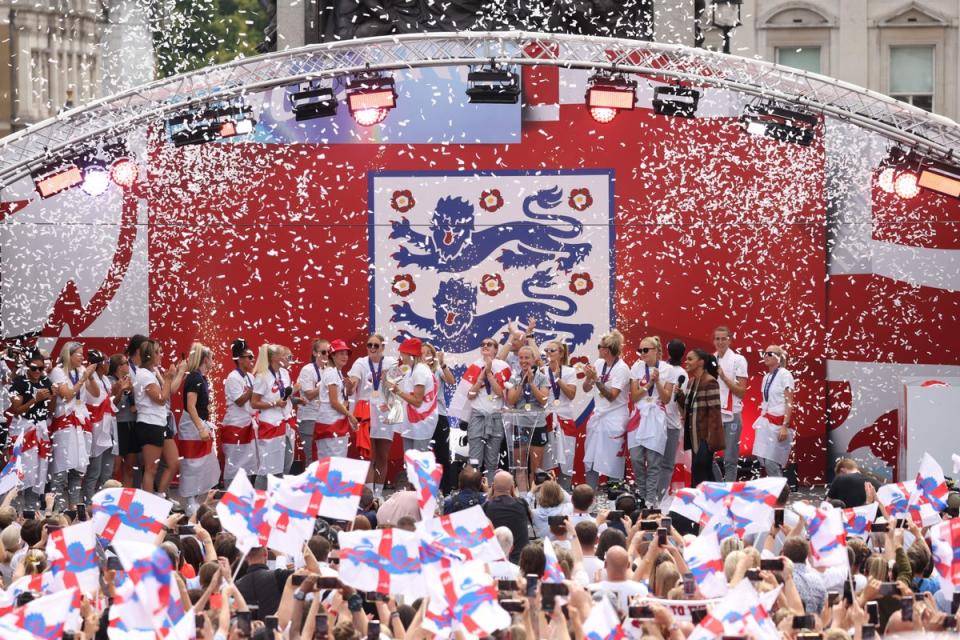 The England Women players celebrate their first trophy, at a victory party in London (AFP via Getty Images)