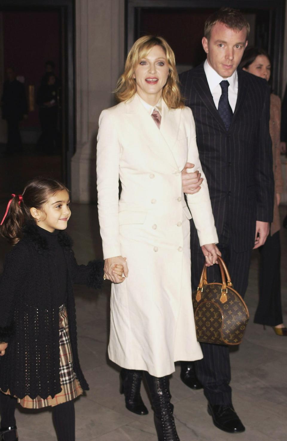 Londoner: Madonna, Guy Ritchie and Lourdes attend the Mario Testino Exhibition at The National Portrait Gallery, 2002 (Getty Images)