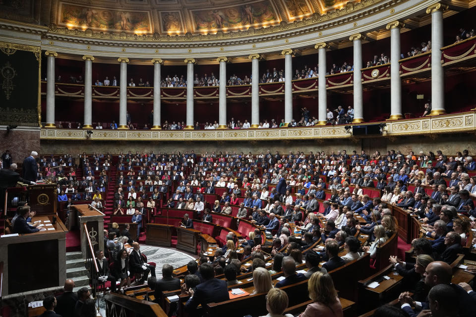 Newly elected parliament members sit at the National Assembly, Tuesday, June 28, 2022 in Paris. France's National Assembly convenes for the first time since President Emmanuel Macron lost his parliamentary majority. (AP Photo/Michel Euler)