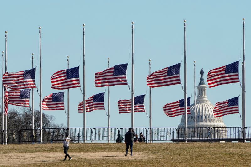 FILE PHOTO: Flags fly at half staff in memory of 500,000 deaths due to the COVID-19 in Washington