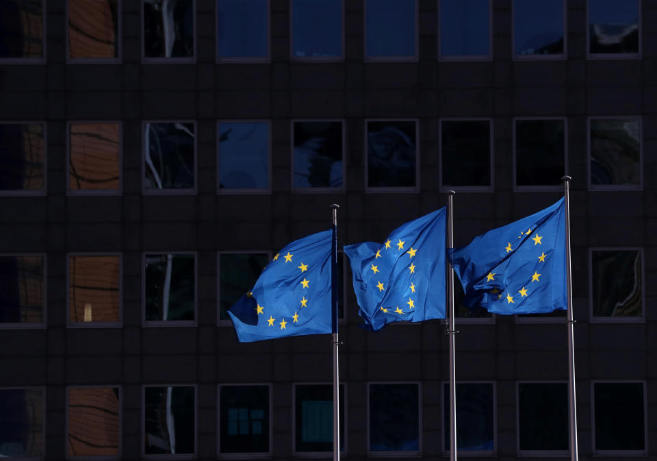 European Union flags fly outside the European Commission headquarters in Brussels, Belgium, February 19, 2020. REUTERS/Yves Herman