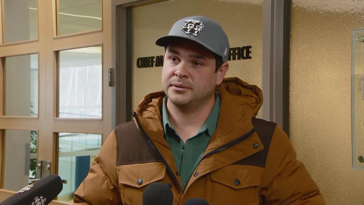 Calgary business owner Landon Johnston speaks to reporters at city hall on Friday following his 15-minute conversation with Mayor Jyoti Gondek. (Laurence Taschereau/CBC - image credit)