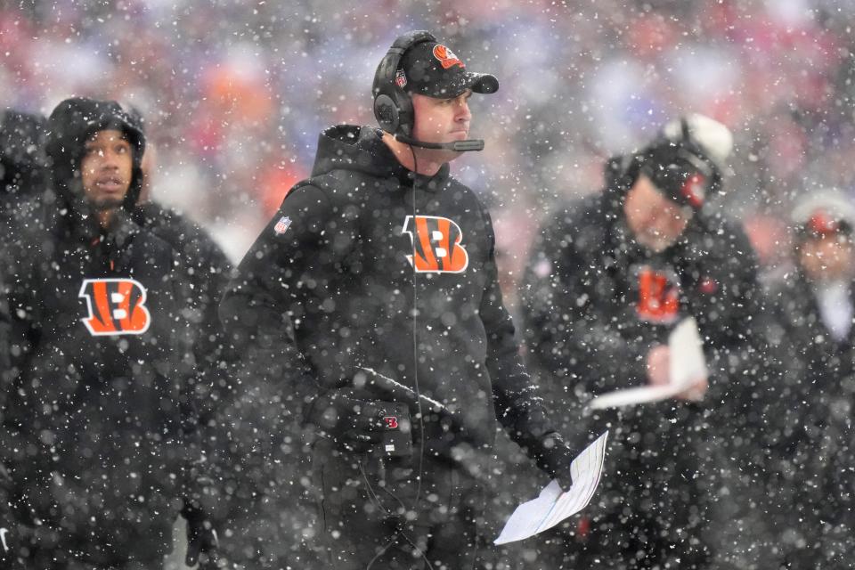 Cincinnati Bengals head coach Zac Taylor observes play in the first quarter during an NFL divisional playoff football game between the Cincinnati Bengals and the Buffalo Bills, Sunday, Jan. 22, 2023, at Highmark Stadium in Orchard Park, N.Y. 