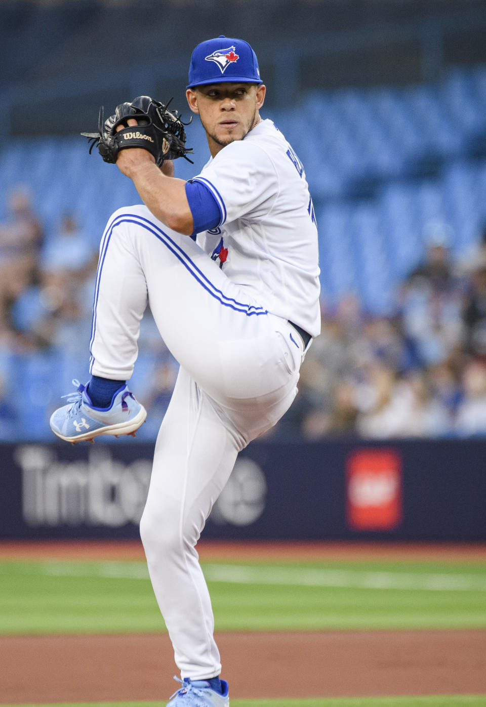 Toronto Blue Jays starting pitcher Jose Berrios winds up during the first inning of the team's baseball game against the Tampa Bay Rays on Friday, April 14, 2023, in Toronto. (Christopher Katsarov/The Canadian Press via AP)