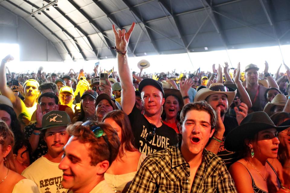 Country music fans react during the Ryan Bingham set on the Palomino Stage during Stagecoach at the Empire Polo Club in Indio, Calif., Sunday, April 30, 2023.