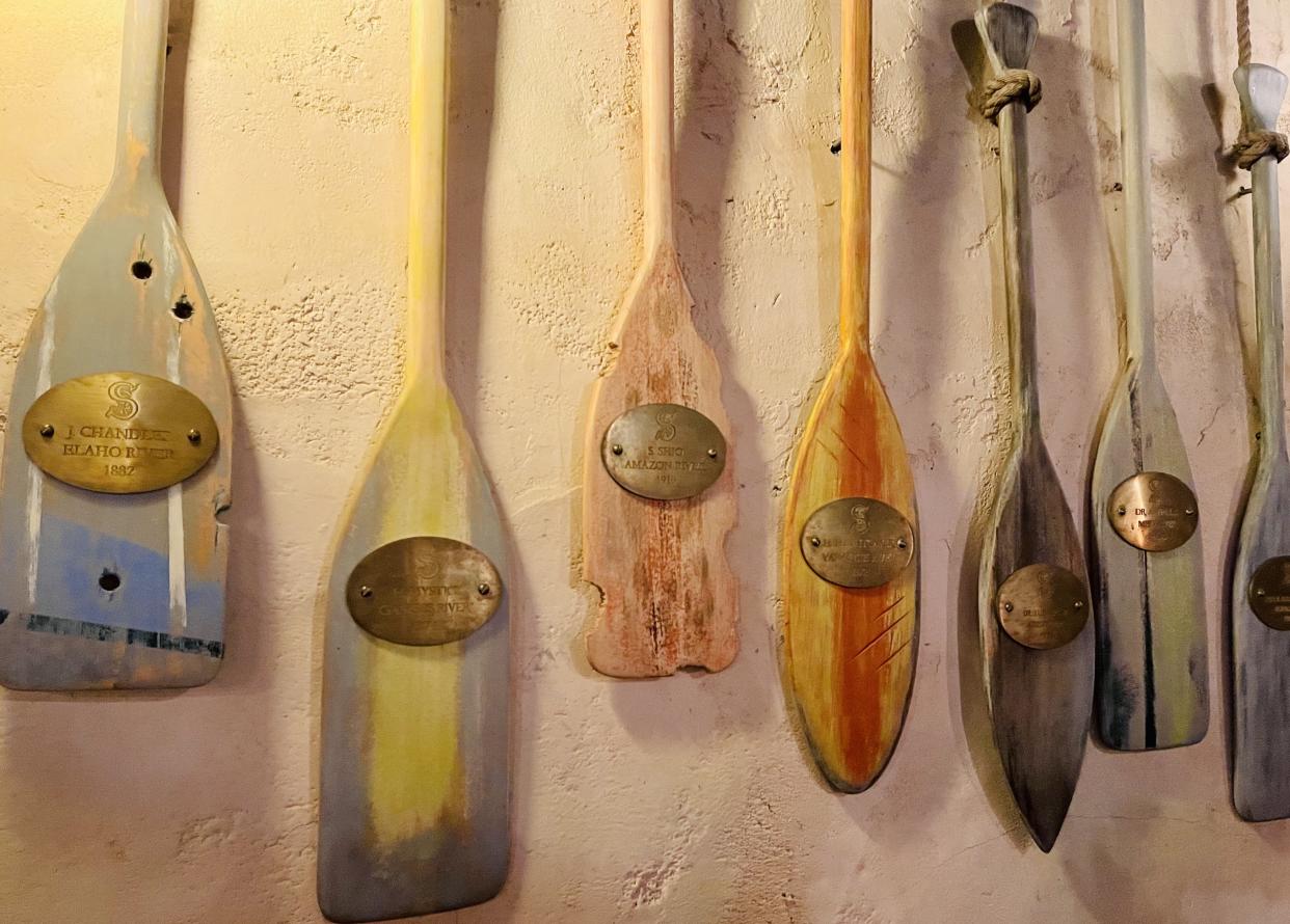 S.E.A. member expedition paddles, displayed at Disneyland's Tropical Hideaway. (Photo: Carly Caramanna)