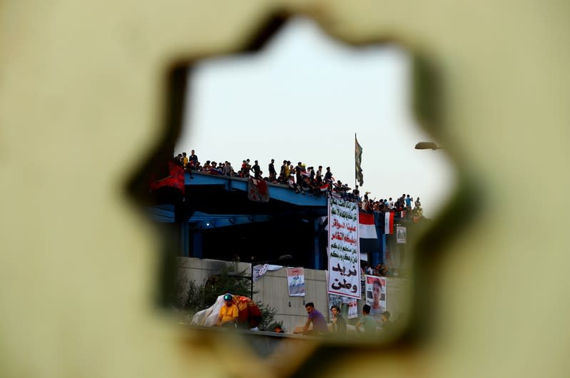 Iraqi demonstrators take part in the ongoing anti-government protests in Baghdad