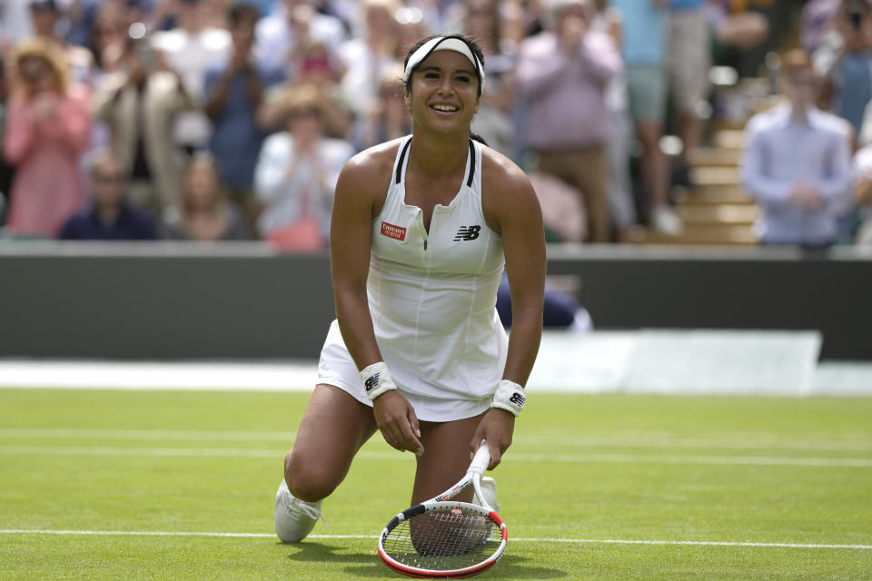 Britain's Heather Watson celebrates defeating Slovenia's Kaja Juvan in a third round women's singles match on day five of the Wimbledon tennis championships in London, Friday, July 1, 2022. (AP Photo/Alastair Grant)