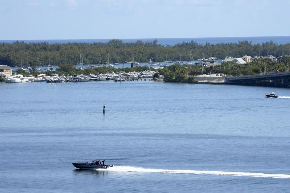 FILE - Boats move through the water near the Miami Marine Stadium Basin, Jan. 19, 2023, in Biscayne Bay, Fla. Country Bay Music Festival is scheduled for Saturday, Nov. 11, and Sunday, Nov. 12, at the historic Miami Marine Stadium, just southeast of downtown on Virginia Key in Biscayne Bay. (AP Photo/Lynne Sladky, File)