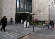 Police stand guard outside St Bartholomew's Hospital where Britain's Prince Philip is being treated in London, Tuesday, March 2, 2021. Buckingham Palace says Prince Philip the 99-year-old husband of Queen Elizabeth II, has been transferred from King Edward VII's Hospital to St Bartholomew's Hospital to undergo testing and observation for a pre-existing heart condition as he continues treatment for an unspecified infection. (AP Photo/Alastair Grant)