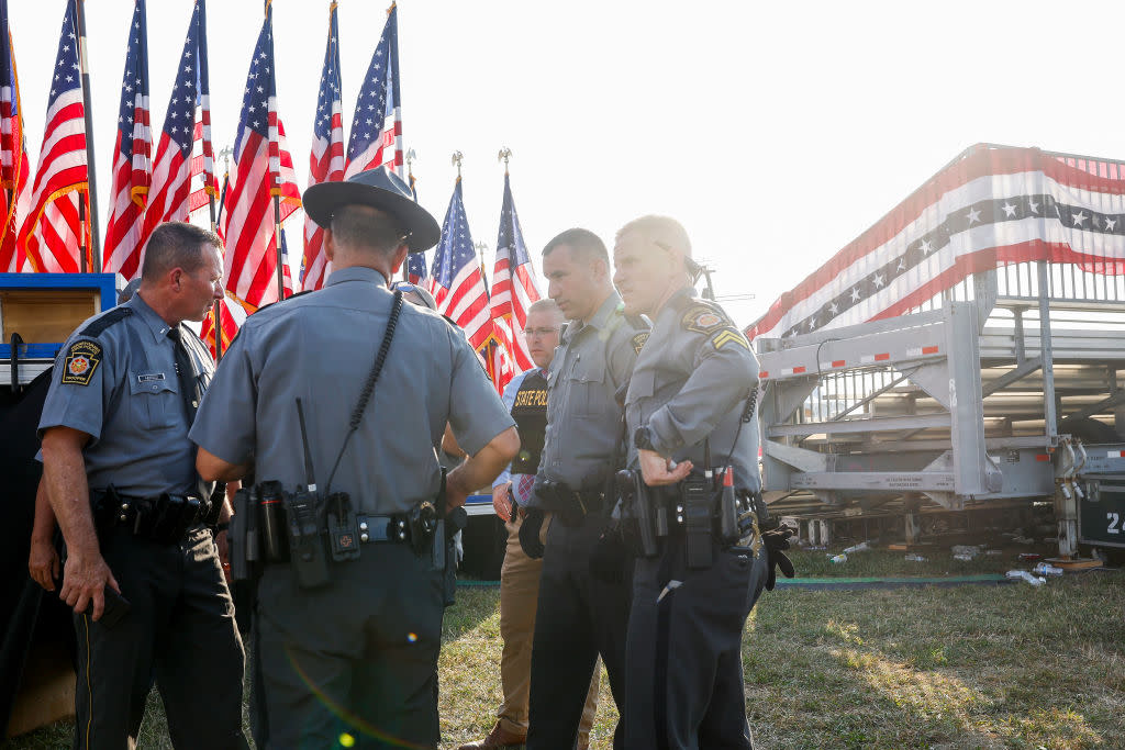 Pennsylvania state police officers stand near the stage of a campaign rally for Republican presidential candidate former President Donald Trump on July 13, 2024, in Butler, Pennsylvania. (Photo by Anna Moneymaker/Getty Images)