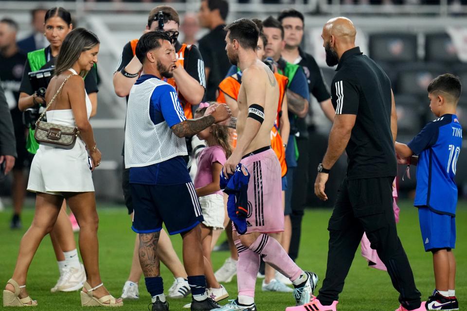 Inter Miami forward Lionel Messi (10) shakes hands with FC Cincinnati midfielder Luciano Acosta (10) at the conclusion of a U.S. Open Cup semifinal match between Inter Miami and FC Cincinnati, Wednesday, Aug. 23, 2023, at TQL Stadium in Cincinnati.