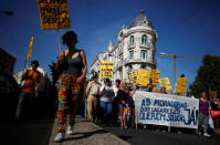 People shout slogans during a demonstration against evictions and rising of rent prices in central Lisbon, Portugal September 22, 2018. REUTERS/Pedro Nunes