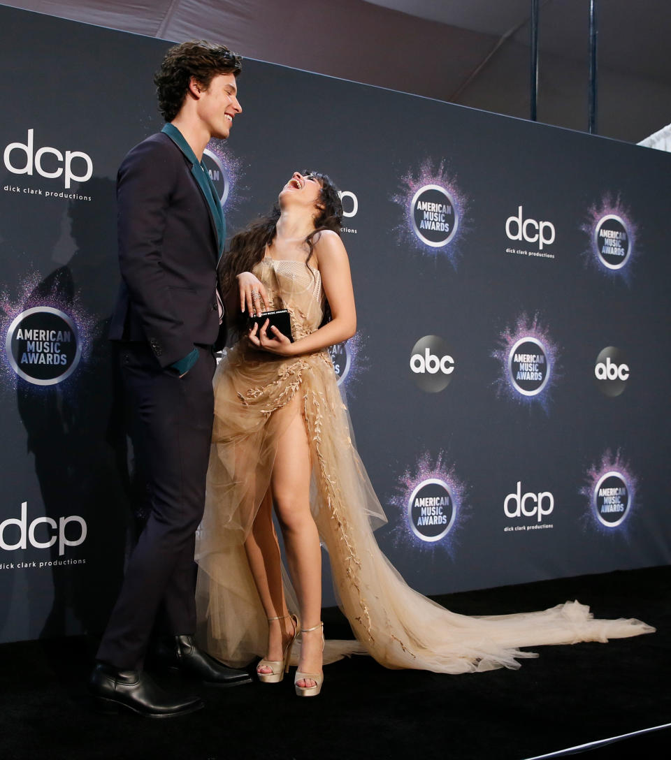 2019 American Music Awards – Photo Room – Los Angeles, California, U.S., November 24, 2019 –  Shawn Mendes and Camila Cabello pose with their award for Collaboration of the Year for Senorita. REUTERS/Danny Moloshok