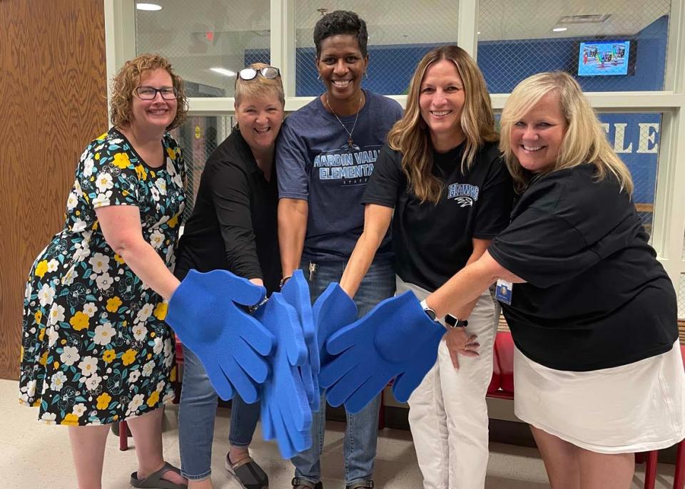 The administrative staff seem to love “Hawk High Five Friday” as much as the kids do at Hardin Valley Elementary School Friday, Aug. 19, 2022. From left: Amber Massengill, Karen Sharpe, Dr. Stephanie Taylor, Lynn Jacomen (principal), and Kristi Whited.