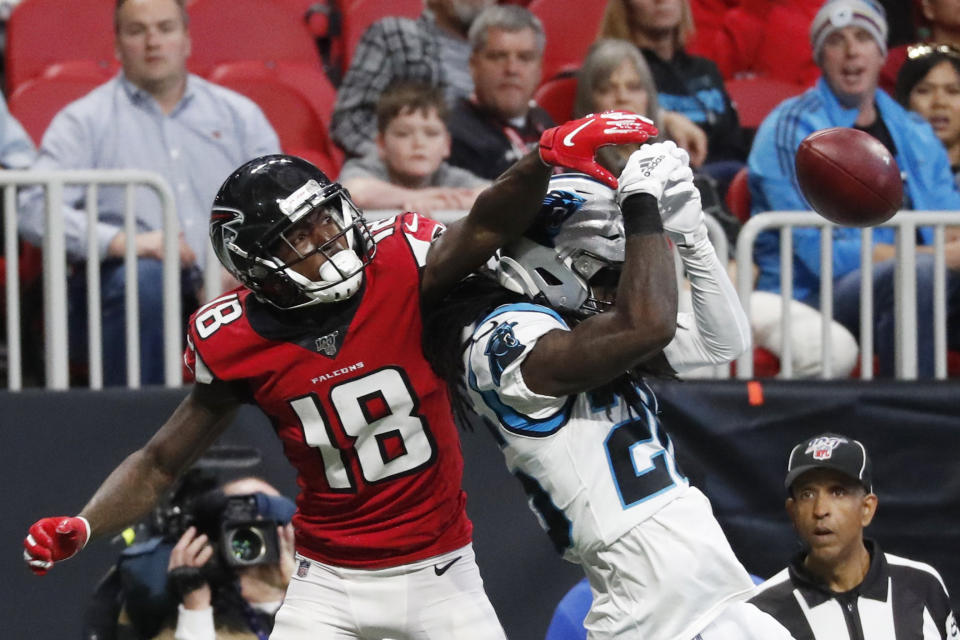 Atlanta Falcons wide receiver Calvin Ridley (18) misses the catch against Carolina Panthers cornerback Donte Jackson (26) during the first half of an NFL football game, Sunday, Dec. 8, 2019, in Atlanta. (AP Photo/John Bazemore)