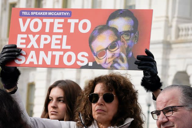 Constituents from the district of Rep. George Santos (R-N.Y.) hold signs during a Feb. 7 news conference outside the U.S. Capitol calling on House Speaker Kevin McCarthy (R-Calif.) to expel Santos.