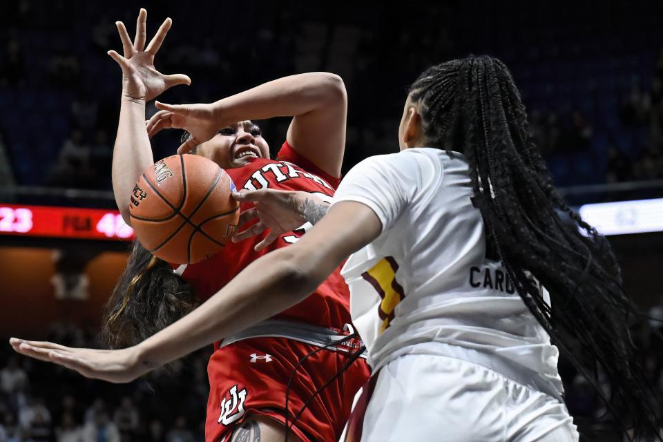 South Carolina center Kamilla Cardoso, right, blocks a shot by Utah forward Alissa Pili, left, in the second half of an NCAA college basketball game, Sunday, Dec. 10, 2023, in Uncasville, Conn. | Jessica Hill, Associated Press
