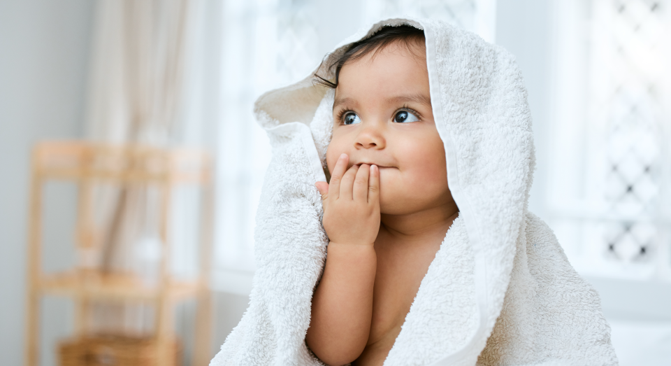 Adorable looking baby during bath time