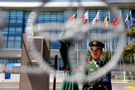 A paramilitary policemen secures the venue of the Belt and Road Forum in Beijing, China, May 14, 2017. REUTERS/Damir Sagolj