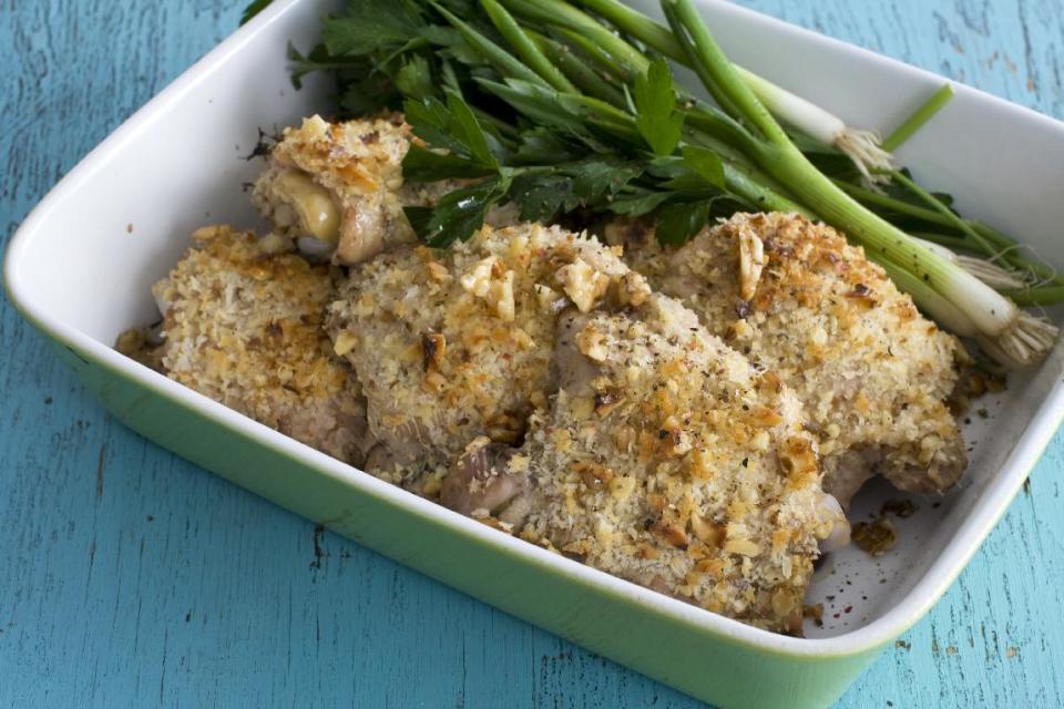 This March 18, 2013 photo taken in Concord, N.H. shows a recipe for herb-brined, walnut-crusted chicken thighs. (AP Photo/Matthew Mead)