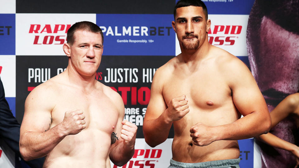 Paul Gallen and Justis Huni, pictured here facing off during the official weigh-in.