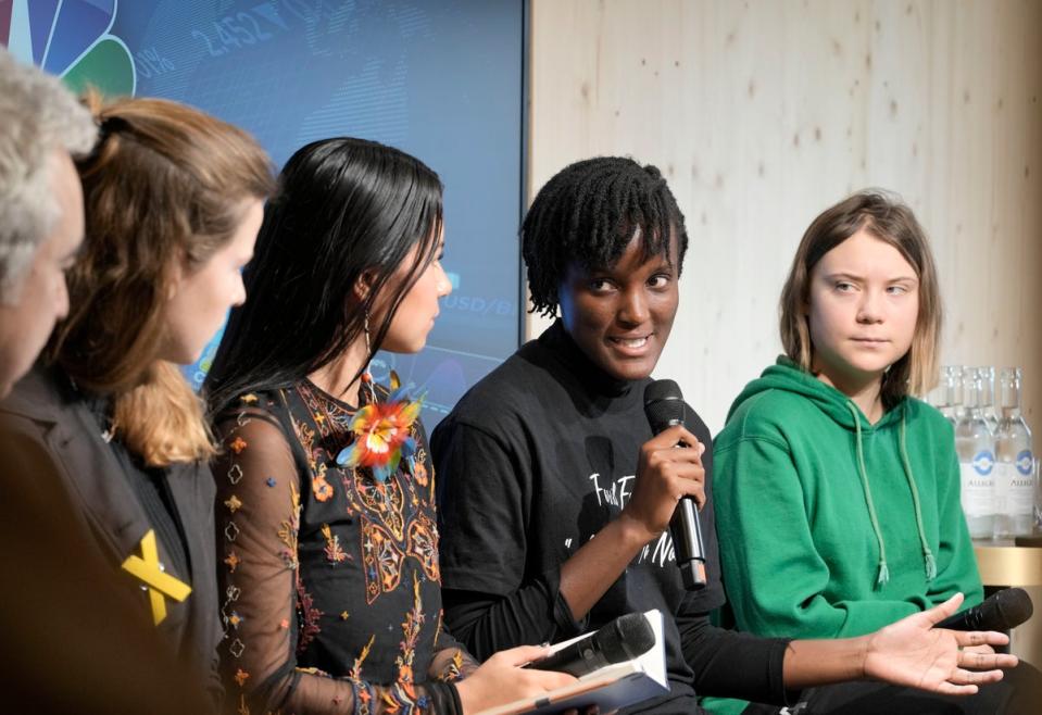 From right: Climate activists Greta Thunberg of Sweden, Vanessa Nakate of Uganda, Helena Gualinga of Ecuador, Luisa Neubauer of Germany, and Fatih Birol, Head of the International Energy Agency, at the World Economic Forum in Davos, Switzerland in January (Copyright 2023 The Associated Press. All rights reserved)