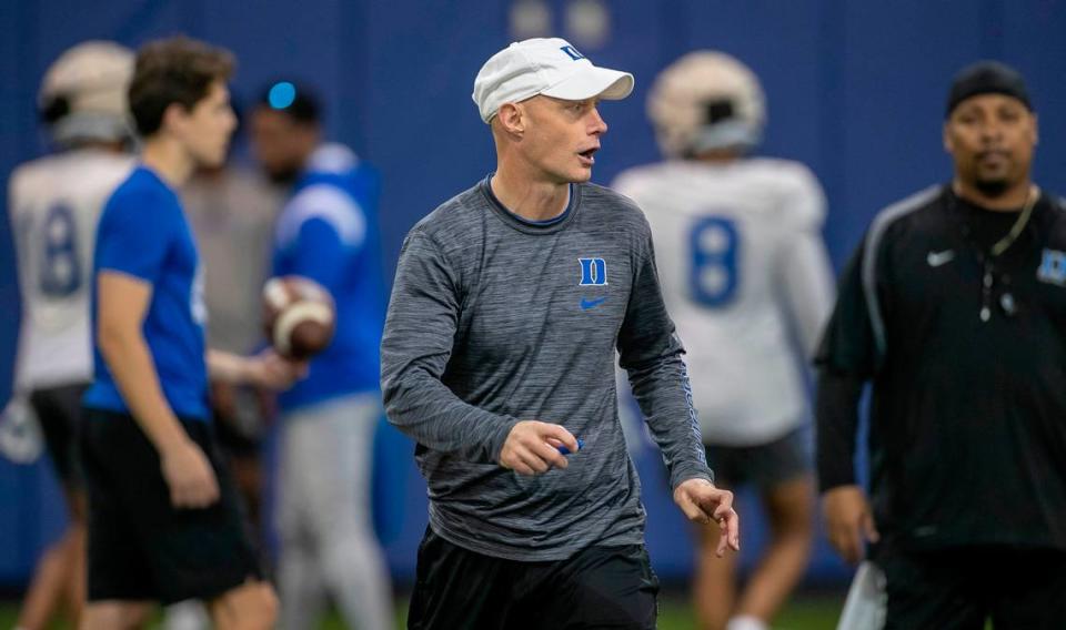 Duke offensive coordinator Kevin Johns works with players during the Blue Devils’ spring practice on Friday, March 24, 2023 in Durham, N.C.