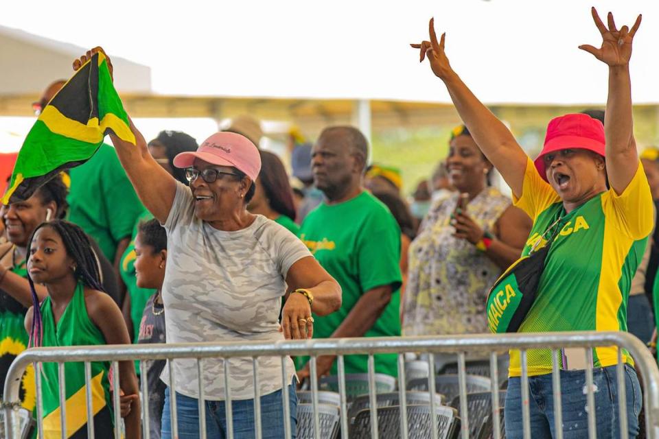 Kay Johnston (left) waves the Jamaican flag while her friend Gillian Brooks cheers during the Jamaica Emancipendence Ole Time Fair at Miramar Regional Park Amphitheater in Miramar, Florida on Saturday, August 6, 2022. The free family-friendly event included kids trampolines, farmers market and dancing in celebration of Jamaica’s 60th Independence Anniversary.