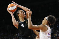 Las Vegas Aces center Liz Cambage (8) shoots against Phoenix Mercury forward Brianna Turner (21) during the second half of Game 5 of a WNBA basketball playoff series, Friday, Oct. 8, 2021, in Las Vegas. (AP Photo/Chase Stevens)