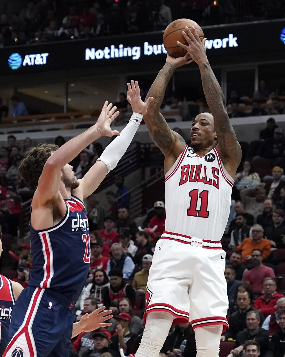 Chicago Bulls' DeMar DeRozan (11) shoots over Washington Wizards' Corey Kispert during the first half of an NBA basketball game Wednesday, Dec. 7, 2022, in Chicago. (AP Photo/Charles Rex Arbogast)