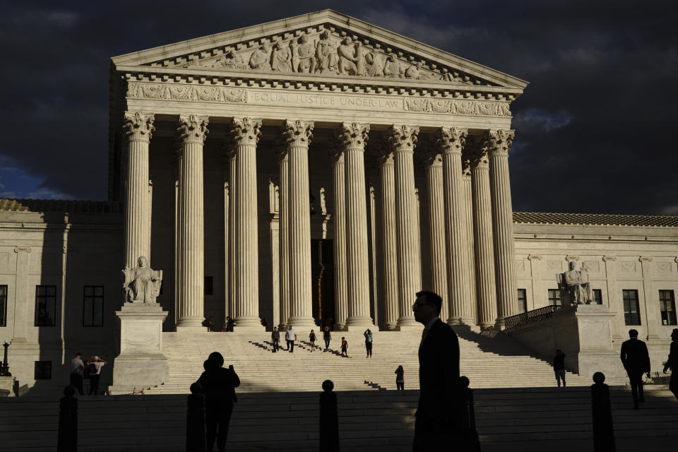 FILE - The U.S Supreme Court building is seen at dusk in Washington on Oct. 22, 2021. Nine months before the next election, Democrats are suffering under the weight of an unpopular president, a surging pandemic, runaway inflation and a stalled agenda. They’re hoping a Supreme Court appointment will help save them. Democrats across the political spectrum embraced Wednesday’s news of 83-year-old liberal Justice Stephen Breyer’s looming retirement, which gives President Joe Biden an opportunity to deliver on a pledge to appoint the first Black woman to the Supreme Court. (AP Photo/J. Scott Applewhite, File)