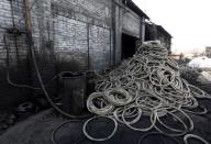 A pile of used tyres is pictured at a pyrolysis unit in Jokhabad