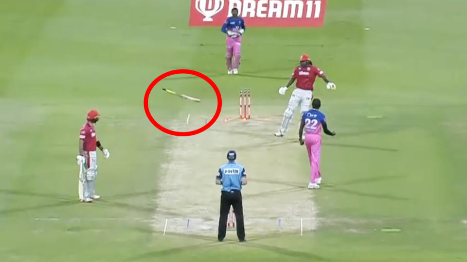 Chris Gayle is pictured throwing his bat in frustration after losing his wicket to Jofra Archer.