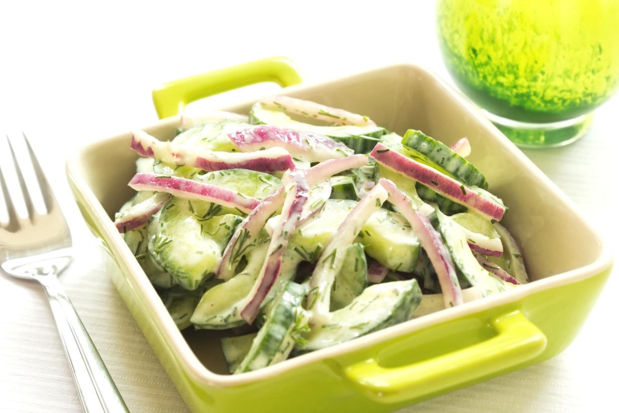 Delicious and healthy cucumber and red onion salad with low fat sour cream dressing