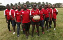 Members of the Kenya Women's Rugby team (L-R) Camilla Cynthia, Shilla Chajira, Irene Otieno, Janet Okello, Catherine Abilla (Captain), Philadelphia Orlando, Celestine Masinde, Linet Moraa and Doreen Remour pose for a photograph after a light training session at the RFUEA grounds in the capital Nairobi, April 4, 2016. REUTERS/Thomas Mukoya