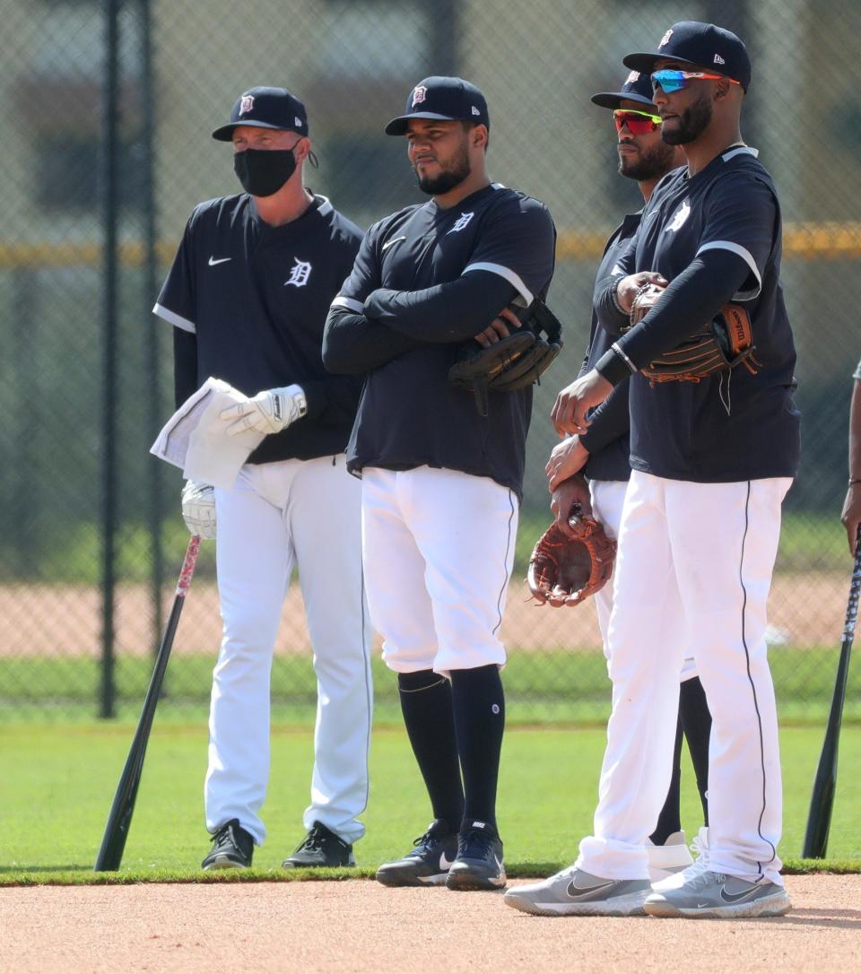 Former Tiger Alan Trammell along with infielders Jeimer Candelario (center), Willo Castro and Niko Goodrum (right) listen Monday, Feb. 22, 2021, on the Tiger Town practice fields at Joker Marchant Stadium in Lakeland, Florida. Monday was the first day position players joined pitchers and catchers for spring training.